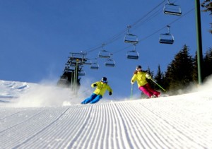Kirkwood skiers heading down a groomer.