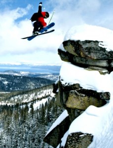 Sierra skier, huge jump off rocks