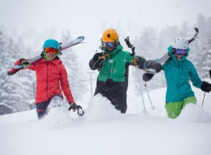 Three giddy skiers walk in knee-deep power today (Feb. 28) at Squaw Valley ski resort in Lake Tahoe.