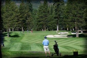 Tahoe Donner Golf Course encompasses 200 acres of pristine Sierra landscape with towering pines, featuring stunning views, meandering creeks, granite rock formations, and elevation changes.