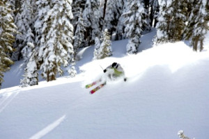 Young man skiing at Kirkwood ski resort near Lake Tahoe, CA.